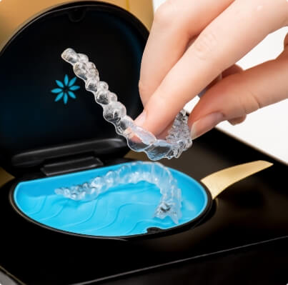 Person taking Invisalign tray from carrying case