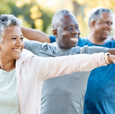 Adults smiling in workout class