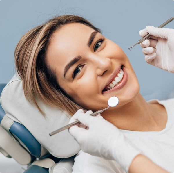 Dentist performing an oral cancer screening