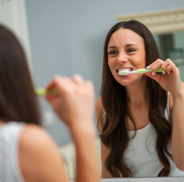 Woman brushing teeth