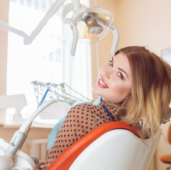 woman in dental chair smiling