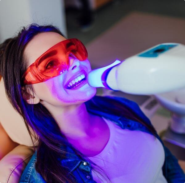 Dental patient receiving zoom teeth whitening