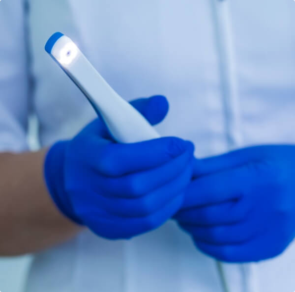 Dentist holding an intraoral camera