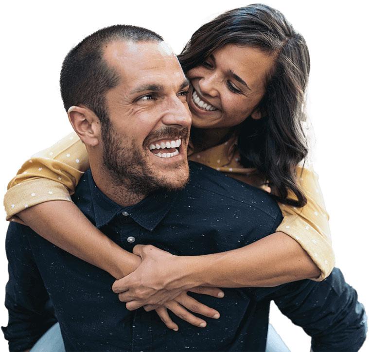 Man and woman smiling after visiting their dentist in Oklahoma City