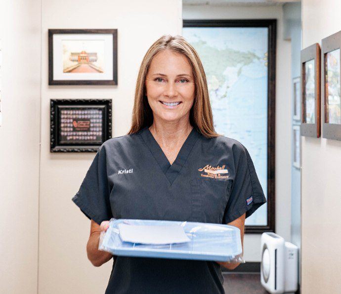 Smiling friendly dental team member