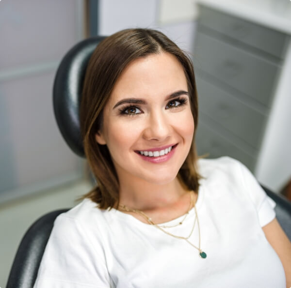 Woman with flawless smile after makeover