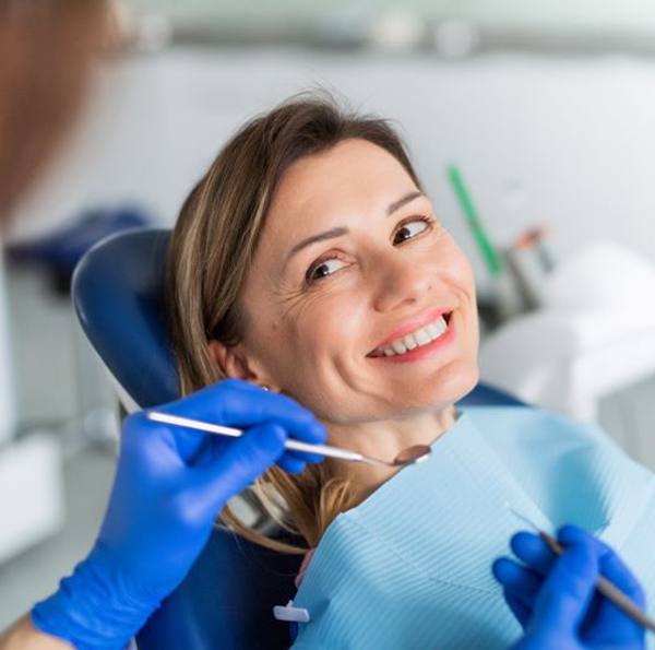 Woman visiting dentist for checkup