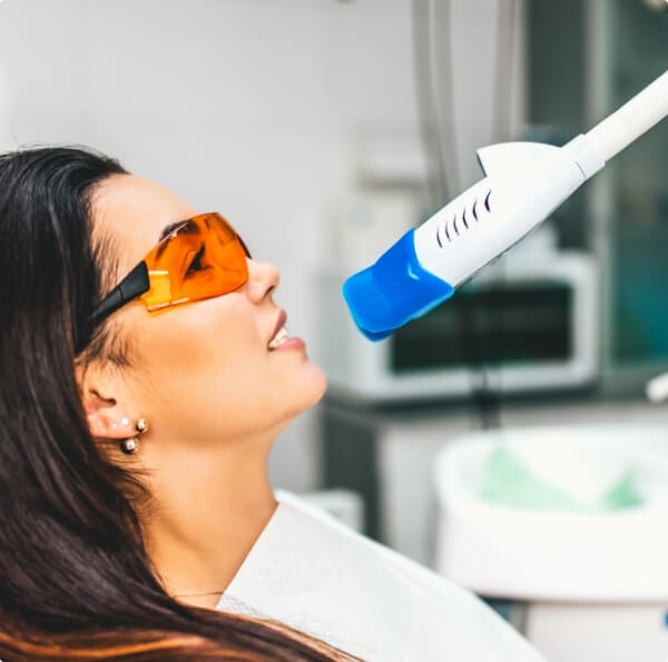 Patient receiving in office teeth whitening