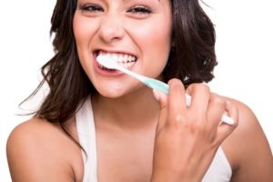 Woman brushing teeth