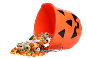 bucket overflowing with halloween candy