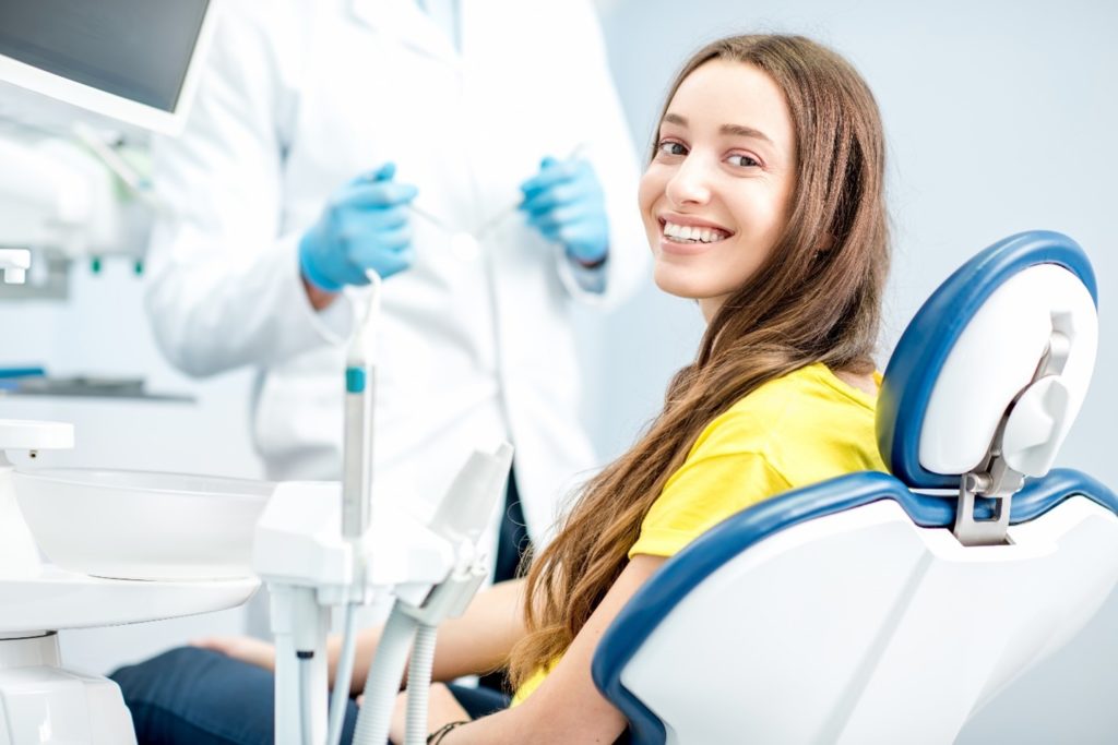Woman smiling in dentist's treatment chair